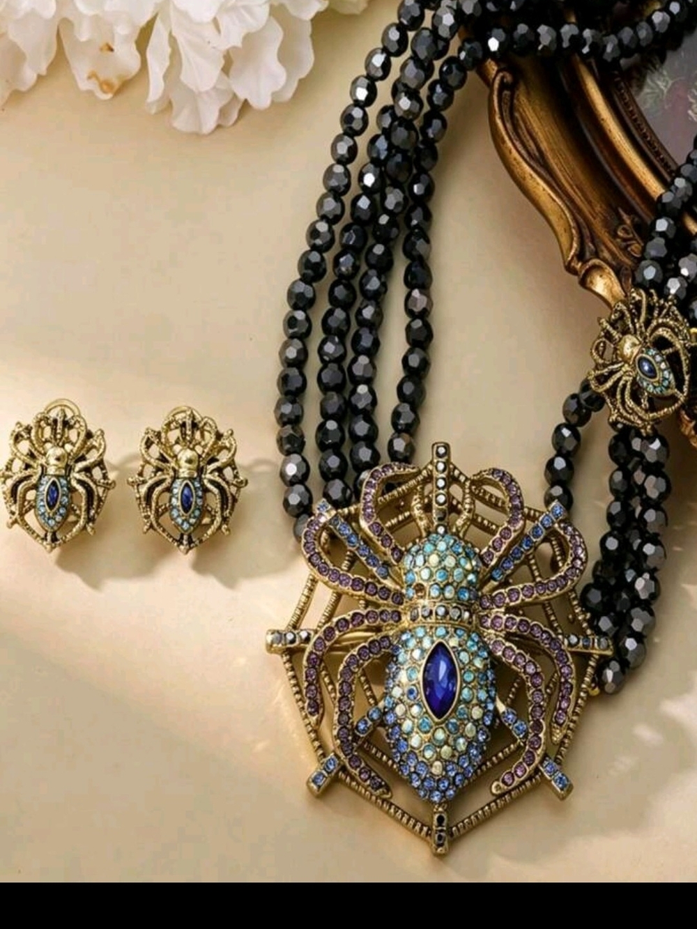 Gold-Tone Blue & Purple Spider Pendant Necklace with Black Bead Strands.